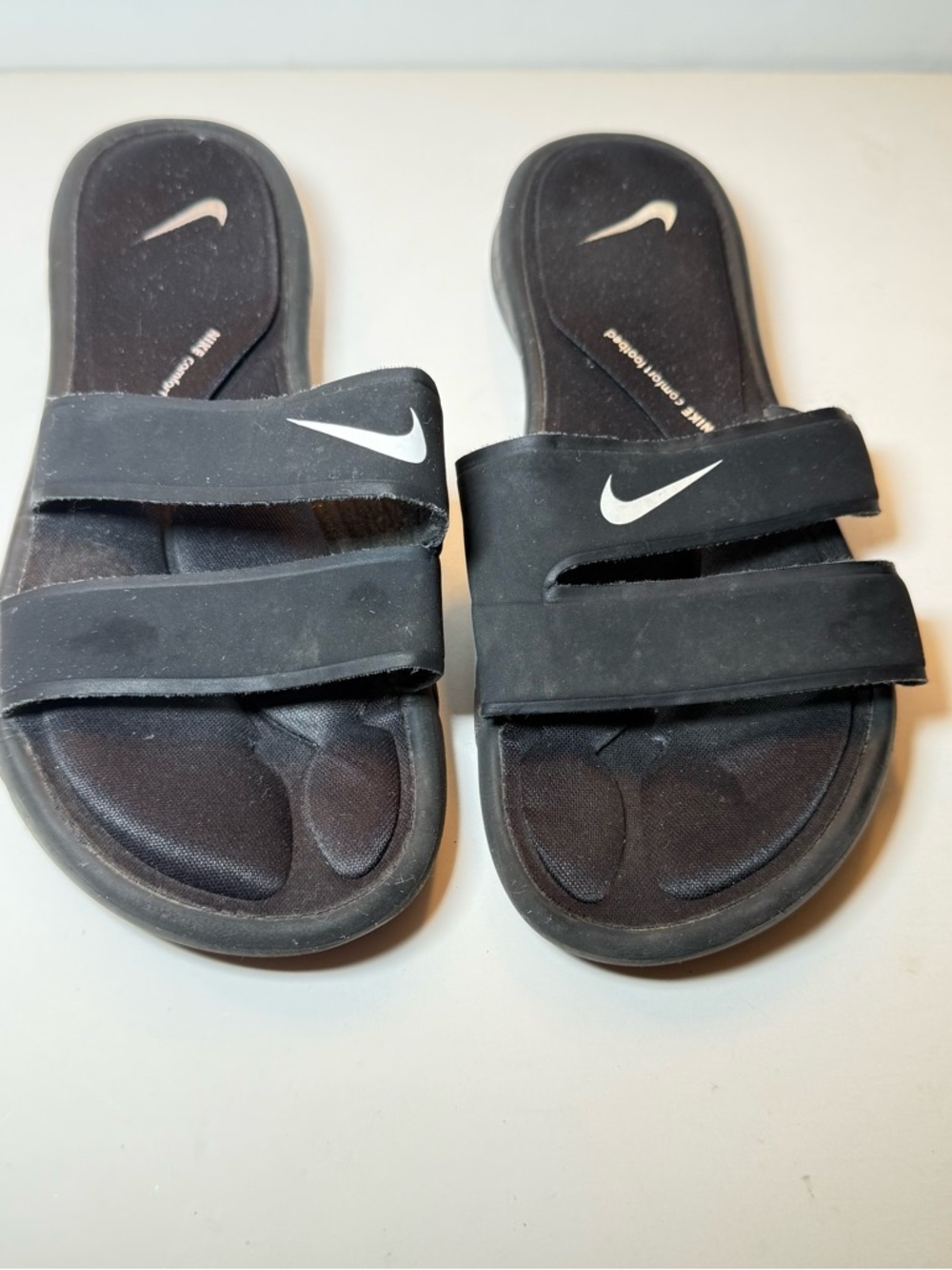 Nike Black Slide Sandals with White Swoosh Accents